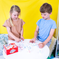 girl and boy playing with Junior Learning JL643 CVC Cubes