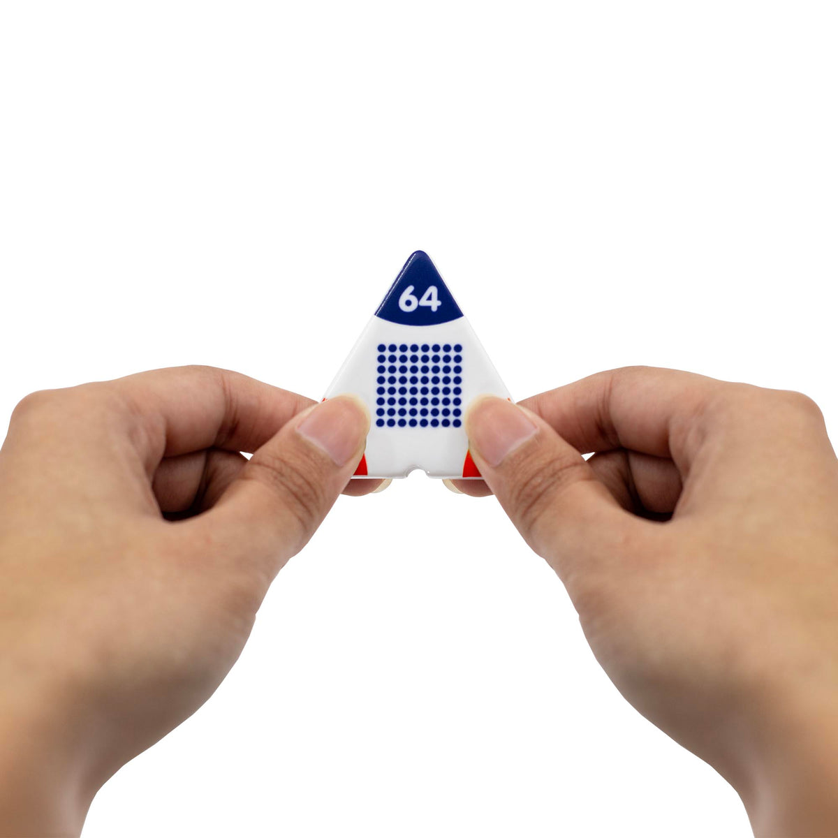 Triangular die with number 64 held between two hands on a white background