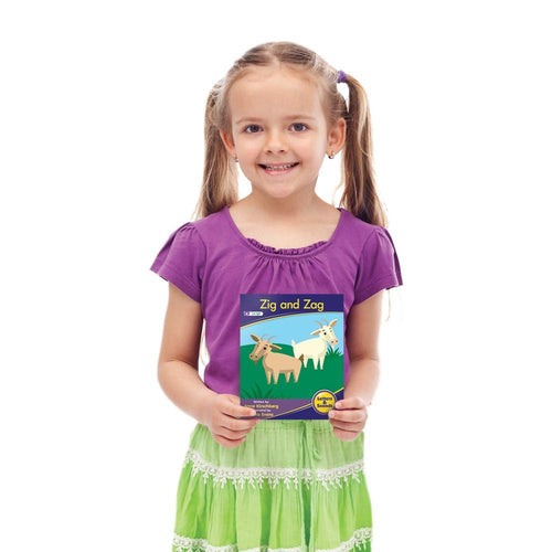 Girl holding Junior Learning JL382 Letters and Sounds Phse 3 Set 1 Fiction